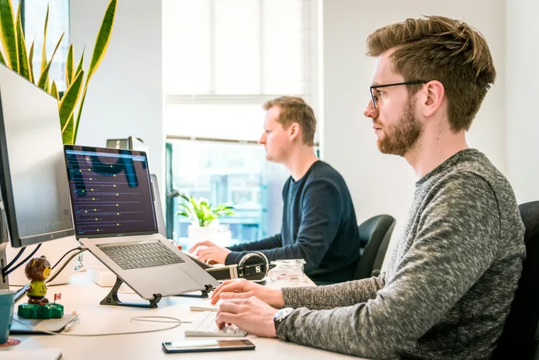 Engineers building software at their workstations